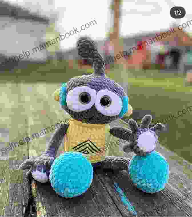 A Knitted Robot With Big Eyes And A Playful Smile. Robot Knit Pattern Amy Gaines